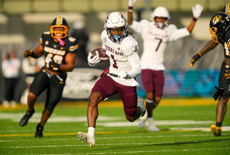 Nov 8, 2025; Columbia, Missouri, USA; Texas A&M Aggies wide receiver Mario Craver (1) runs with the ball during the first half against the Missouri Tigers at Faurot Field at Memorial Stadium. Mandatory Credit: Jay Biggerstaff-Imagn Images