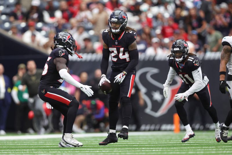 Nov 9, 2025; Houston, Texas, USA; Houston Texans cornerback Derek Stingley Jr. (24) reacts after intercepting a pass during the second quarter against the Jacksonville Jaguars at NRG Stadium. Mandatory Credit: Troy Taormina-Imagn Images