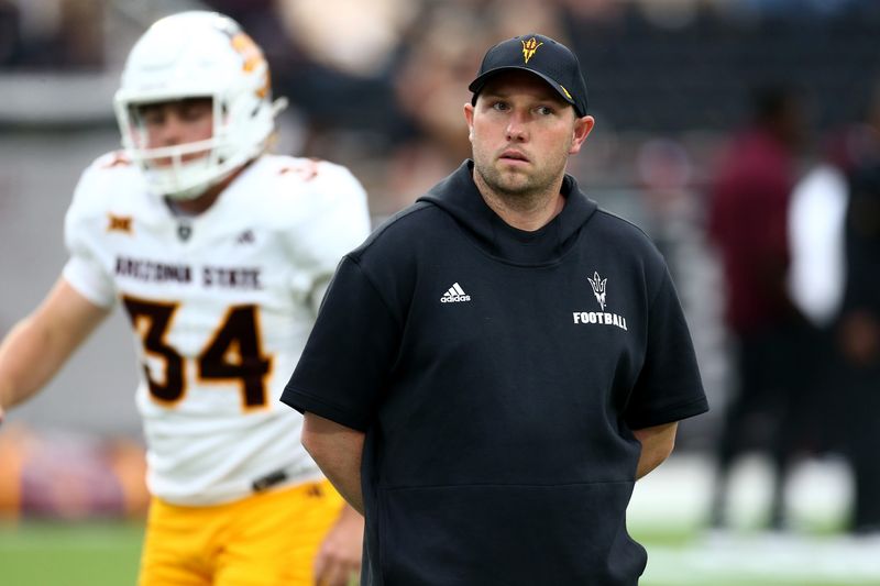 Sep 6, 2025; Starkville, Mississippi, USA; Arizona State Sun Devils head coach Kenny Dillingham looks on during warm ups prior to the game against the Mississippi State Bulldogs at Davis Wade Stadium at Scott Field. Mandatory Credit: Petre Thomas-Imagn Images