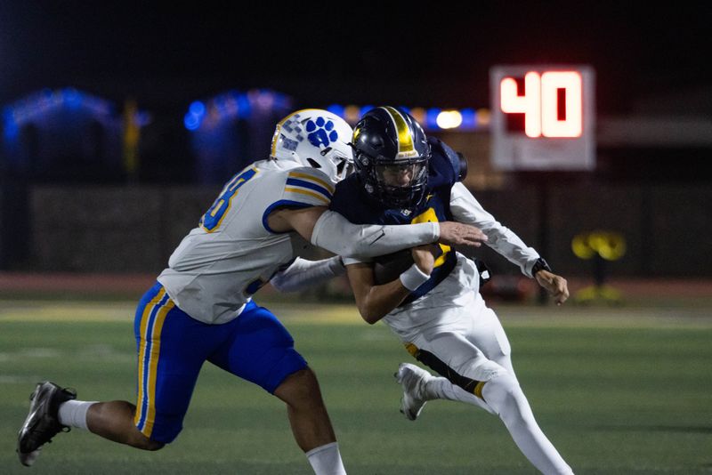 Eastwood's Aidan Manhart fights for yardage Friday night against Frenship at Trooper Stadium