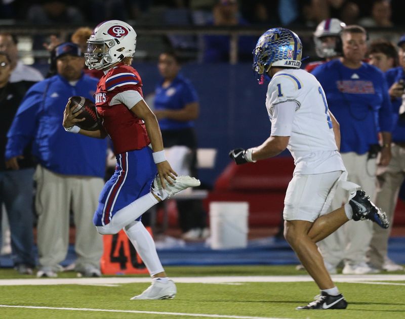 Gregory-Portland quarterback Carter Dominguez speeds past Kerrville Tivy defenders during a bi-district playoff game on Friday, Nov. 14, 2025 at Ray Akins Wildcat Stadium.