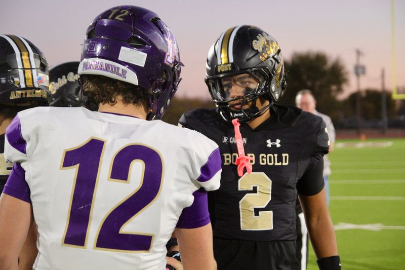 Panhandle's Broxton Robinson shakes hands with Post's Draven Gonzales before a Class 2A Division I bi-district playoff game at Younger Field on Nov. 14, 2025.