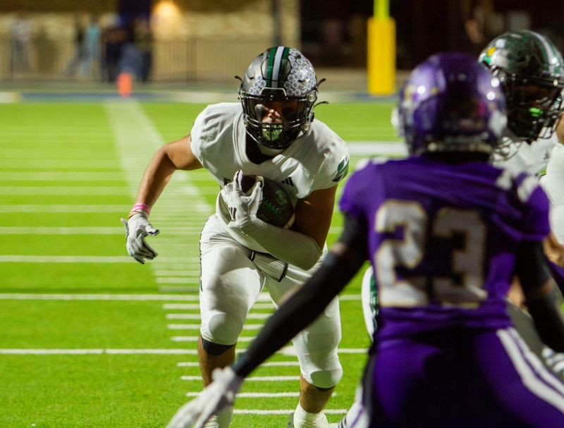 Grape Creek football's Sire Garcia (25) runs with the football against Crane at James H. Bird Memorial Stadium in Big Lake on Friday, Nov. 14, 2025.