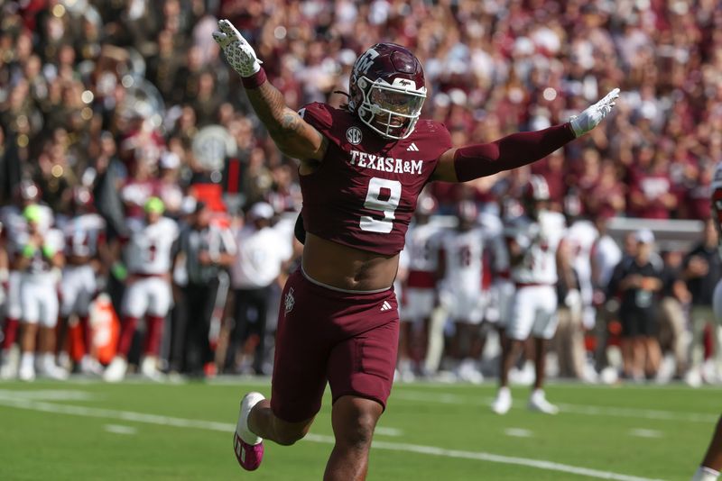 Nov 15, 2025; College Station, Texas, USA; Texas A&M Aggies defensive end Cashius Howell (9) reacts after a defensive play during the first quarter against the South Carolina Gamecocks at Kyle Field. Mandatory Credit: Troy Taormina-Imagn Images