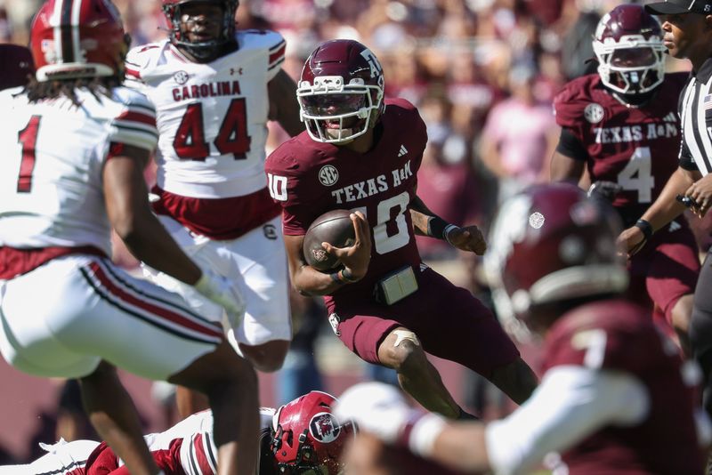 Nov 15, 2025; College Station, Texas, USA; Texas A&M Aggies quarterback Marcel Reed (10) runs with the ball during the third quarter against the South Carolina Gamecocks at Kyle Field. Mandatory Credit: Troy Taormina-Imagn Images