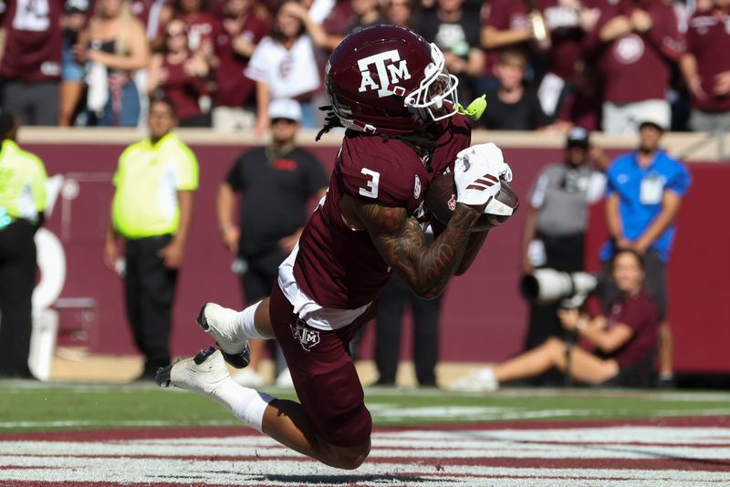 Nov 15, 2025; College Station, Texas, USA; Texas A&M Aggies wide receiver Ashton Bethel-Roman (3) makes a catch for a touchdown during the third quarter against the South Carolina Gamecocks at Kyle Field. Mandatory Credit: Troy Taormina-Imagn Images