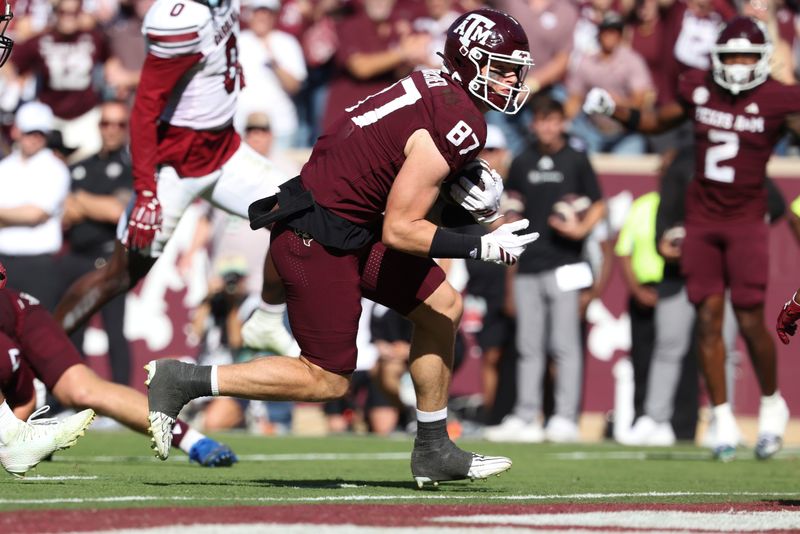Nov 15, 2025; College Station, Texas, USA; Texas A&M Aggies tight end Nate Boerkircher (87) runs into the end zone for a touchdown during the third quarter against the South Carolina Gamecocks at Kyle Field. Mandatory Credit: Troy Taormina-Imagn Images