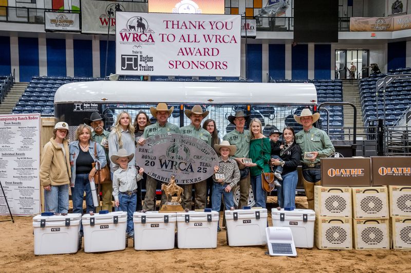 2025 WRCA World Champion team Barron-Highsmith Cattle Co and Short Ranches stands with family and their winnings in the Amarillo Civic Center after the World Championship Ranch Rodeo competition ended on Sunday, Nov. 16.