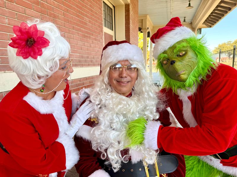 The Grinch reveals a familiar face behind the beard. The Railway Museum’s 2025 Santa Claus is San Angelo City Manager Daniel Valenzuela.