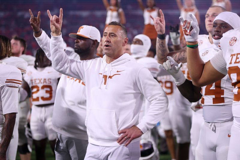 Nov 15, 2025; Athens, Georgia, USA; Texas Longhorns head coach Steve Sarkisian and team gesture after the game against the Georgia Bulldogs at Sanford Stadium. Mandatory Credit: Brett Davis-Imagn Images