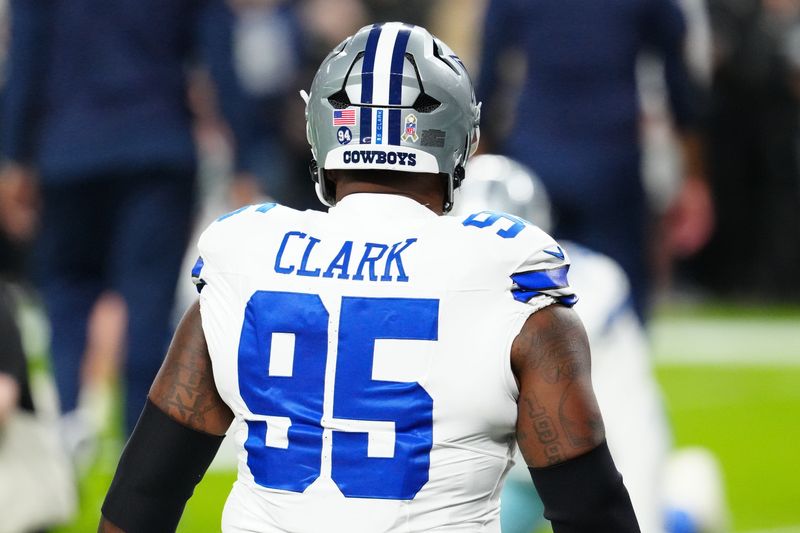 Dallas Cowboys defensive tackle Kenny Clark warms up prior to a game against the Las Vegas Raiders at Allegiant Stadium. The Cowboys will wear Ò94Ó decals on their helmets to honor teammate Marshawn Kneeland who tragically passed on November 6th.