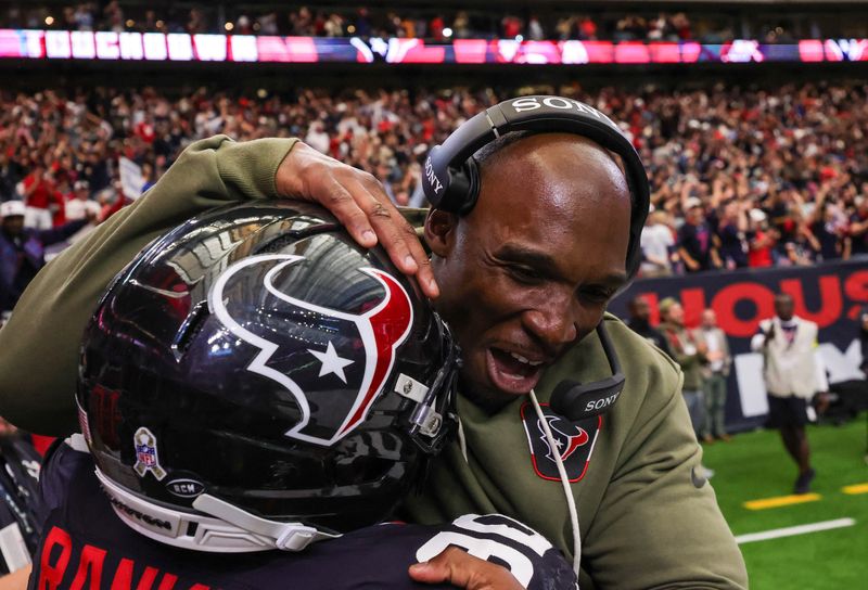 Nov 9, 2025; Houston, Texas, USA; Houston Texans head coach DeMeco Ryans celebrates with defensive tackle Sheldon Rankins (90 after Rakins intercepted the ball for a touchdown against the Jacksonville Jaguars in the fourth quarter at NRG Stadium. Mandatory Credit: Thomas Shea-Imagn Images