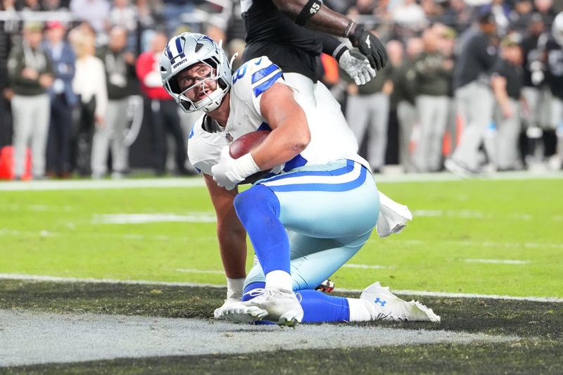 Nov 17, 2025; Paradise, Nevada, USA; Dallas Cowboys tight end Jake Ferguson (87) scores a touchdown during the first half against the Las Vegas Raiders at Allegiant Stadium. Mandatory Credit: Stephen R. Sylvanie-Imagn Images