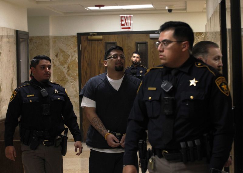Xavier Garcia is escorted out of the 137th District Court where he was sentenced to life in prison without parole after admitting to the 2018 slayings of Kmydron Jordan and Katrina Castillo.