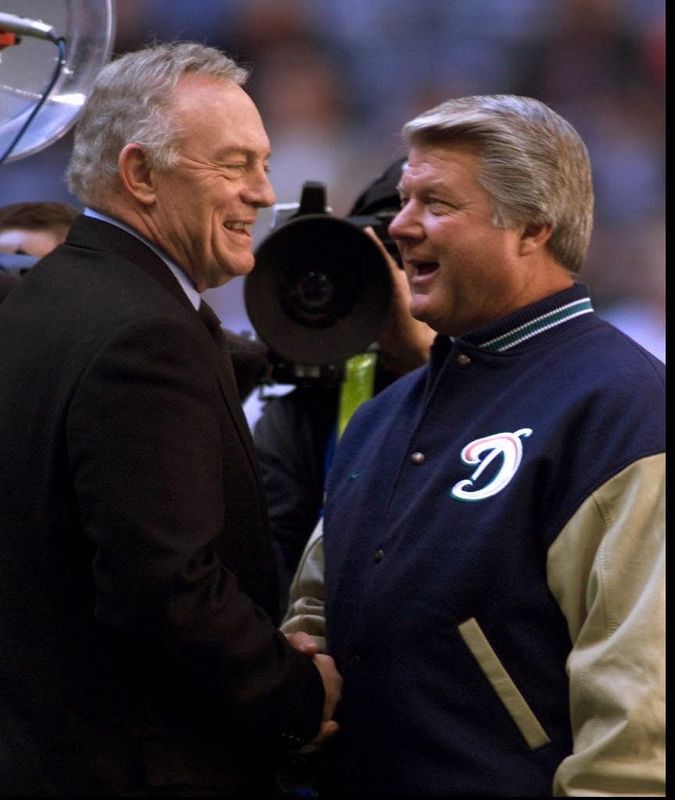 112599 Cowboy owner Jerry Jones and Dolphins coach Jimmy Johnson meet before the Thanksgiving Day game in Dallas.