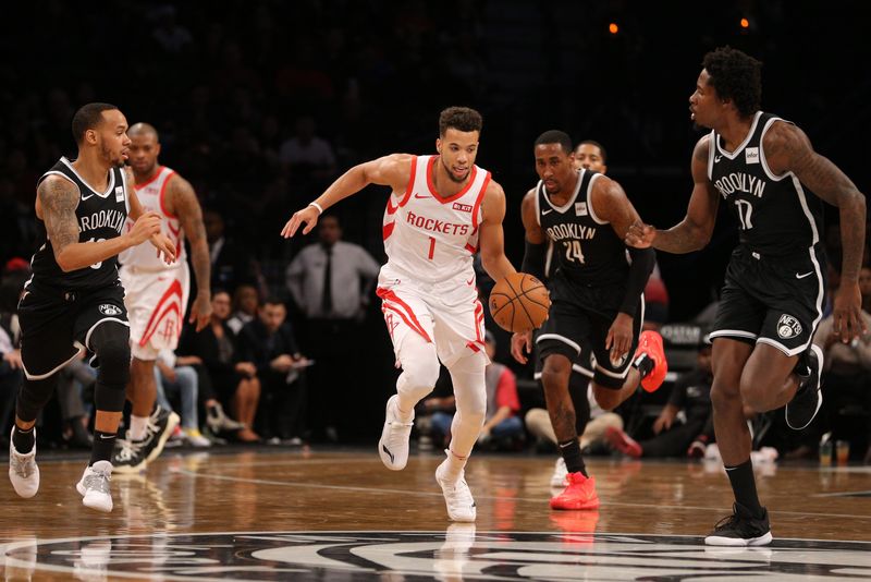 Nov 2, 2018; Brooklyn, NY, USA; Houston Rockets guard Michael Carter-Williams (1) controls the ball against Brooklyn Nets guard Shabazz Napier (13) and forward Rondae Hollis-Jefferson (24) and center Ed Davis (17) during the first quarter at Barclays Center. Mandatory Credit: Brad Penner-USA TODAY Sports