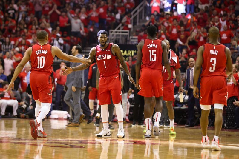 May 10, 2019; Houston, TX, USA; Houston Rockets guard Iman Shumpert (1) guard Eric Gordon (10) center Clint Capela (15) and guard Chris Paul (3) walk off the court during a Golden State Warriors timeout in game six of the second round of the 2019 NBA Playoffs at Toyota Center. Mandatory Credit: Thomas B. Shea-USA TODAY Sports