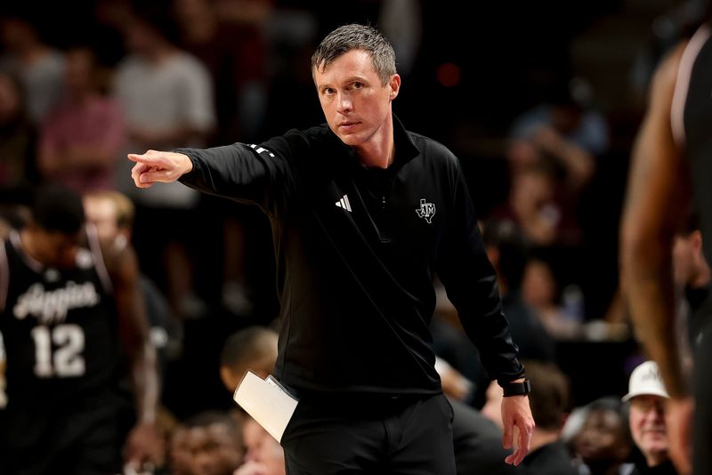 Nov 21, 2025; College Station, Texas, USA; Texas A&M Aggies head coach Bucky McMillan motions during the first half against the Manhattan Jaspers at Reed Arena. Mandatory Credit: Maria Lysaker-Imagn Images