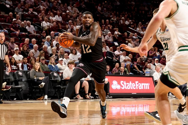 Nov 21, 2025; College Station, Texas, USA; Texas A&M Aggies forward Rashaun Agee (12) drives to the basket against the Manhattan Jaspers at Reed Arena. Mandatory Credit: Maria Lysaker-Imagn Images