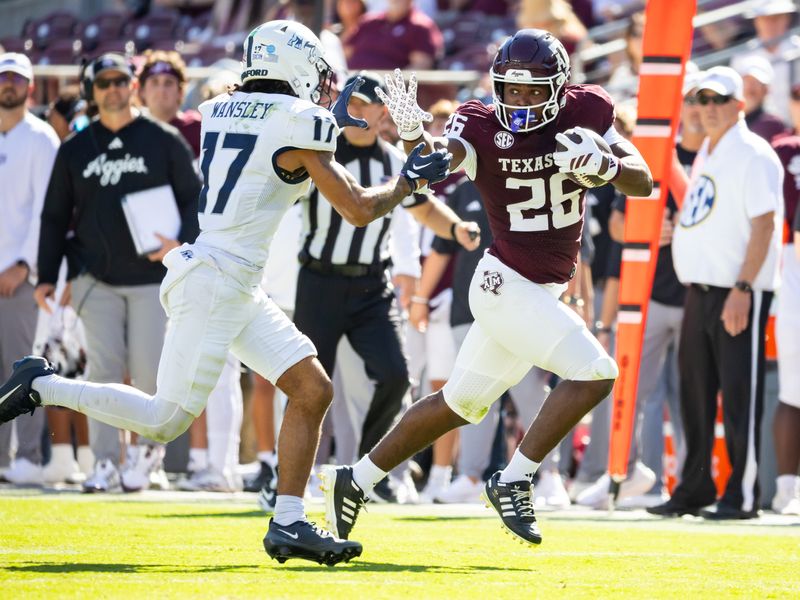 Nov 22, 2025; College Station, Texas, USA; Texas A&M Aggies running back Tiger Riden Jr. (26) runs with the ball in the second half of a game against the Samford Bulldogs at Kyle Field. Mandatory Credit: Joseph Buvid-Imagn Images