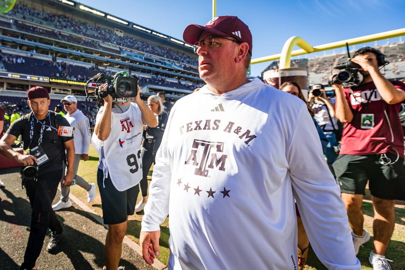 Nov 22, 2025; College Station, Texas, USA; Texas A&M Aggies head coach Mike Elko walks off the field after defeating the Samford Bulldogs 48-0 in a game at Kyle Field. Mandatory Credit: Joseph Buvid-Imagn Images
