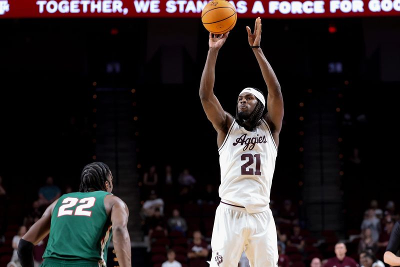 Nov 25, 2025; College Station, Texas, USA; Texas A&M Aggies forward Mackenzie Mgbako (21) attempts a three point basket during the first half against the Mississippi Valley State Delta Devils at Reed Arena. Mandatory Credit: Maria Lysaker-Imagn Images