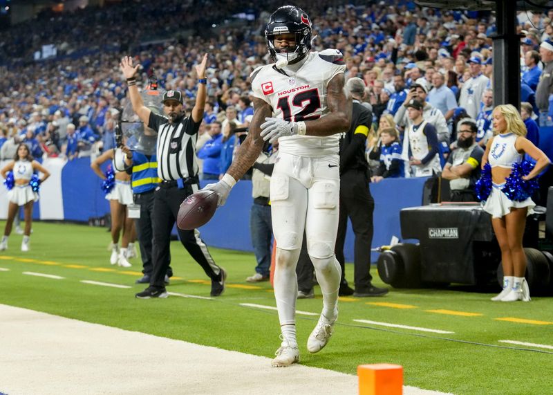 Nov 30, 2025; Indianapolis, Indiana, USA; Houston Texans wide receiver Nico Collins (12) scores a touchdown during a game against the Indianapolis Colts at Lucas Oil Stadium. Mandatory Credit: Christine Tannous-USA TODAY Network via Imagn Images