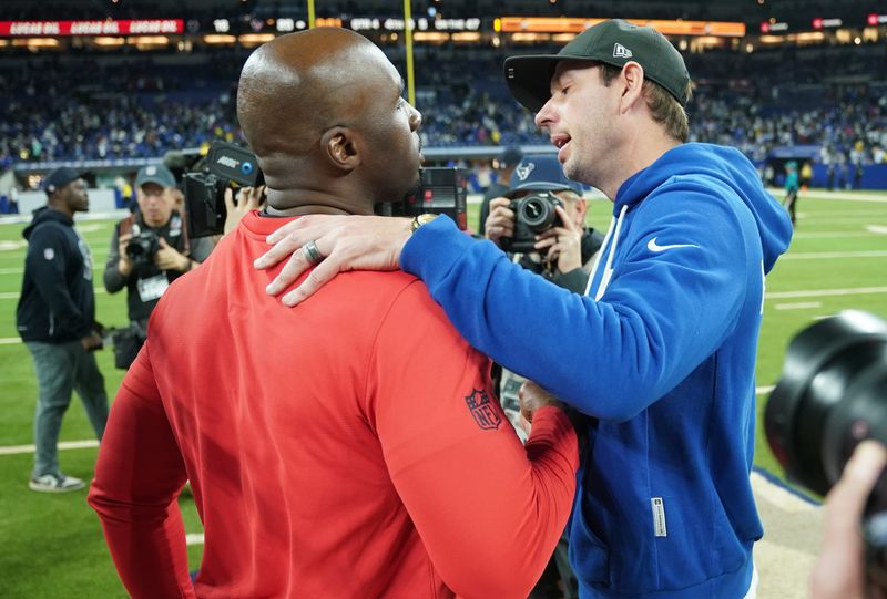 Nov 30, 2025; Indianapolis, Indiana, USA; Houston Texans head coach DeMeco Ryans and Indianapolis Colts head coach Shane Steichen greet each other after a game at Lucas Oil Stadium. Mandatory Credit: Robert Goddin-Imagn Images