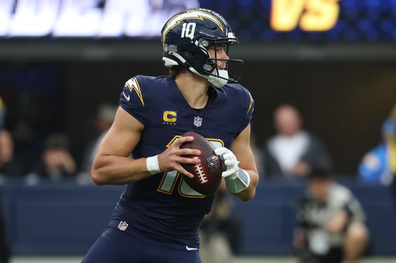 Los Angeles Chargers quarterback Justin Herbert (10) drops back to pass against the Las Vegas Raiders during the second half at SoFi Stadium in Inglewood, California on Nov. 30, 2025.
