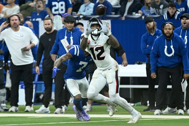 Nov 30, 2025; Indianapolis, Indiana, USA; Houston Texans wide receiver Nico Collins (12) makes a catch against Indianapolis Colts cornerback Charvarius Ward (7) during the second half at Lucas Oil Stadium. Mandatory Credit: Robert Goddin-Imagn Images