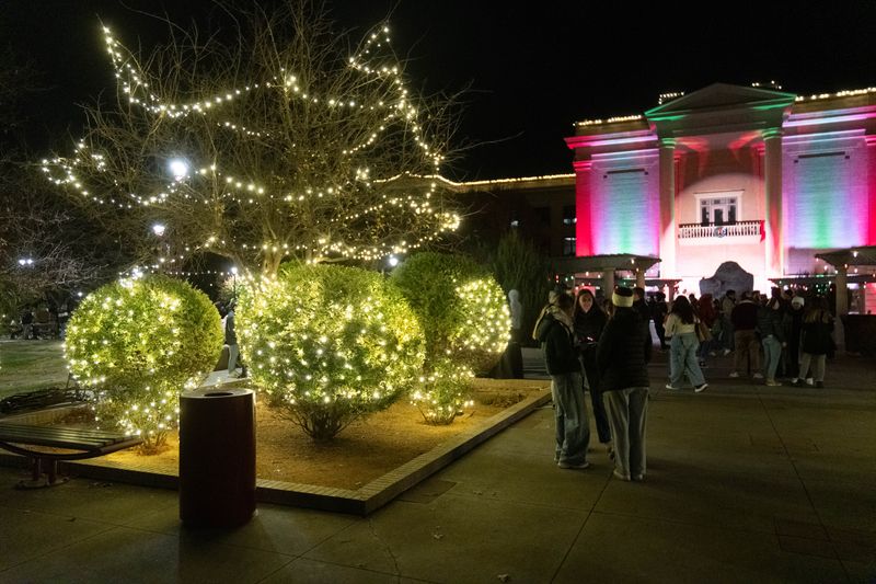 Holiday lights glow across the campus lawn as students gather outside Old Main building during West Texas A&M University’s Christmas celebration on Dec. 3 in Canyon.