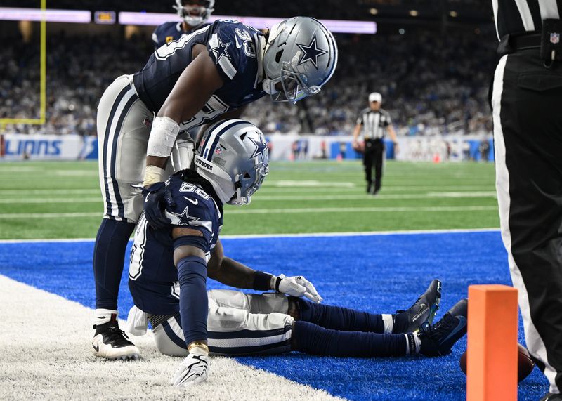 Dec 4, 2025; Detroit, Michigan, USA; Dallas Cowboys wide receiver CeeDee Lamb (88) is helped by Dallas Cowboys running back Javonte Williams (33) after being injured during the second half against the Detroit Lions at Ford Field. Mandatory Credit: Lon Horwedel-Imagn Images