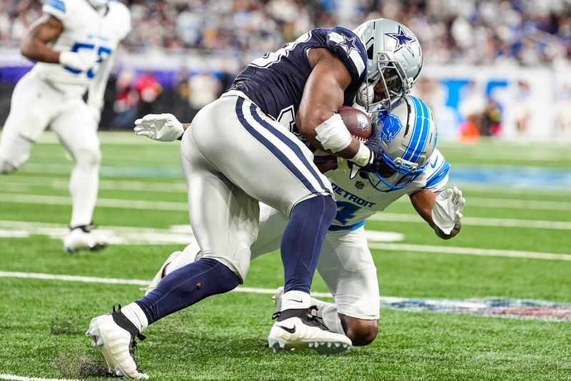 Detroit Lions cornerback D.J. Reed (4) defends Dallas Cowboys running back Javonte Williams (33) during the first half at Ford Field in Detroit on Thursday, Dec. 4, 2025.