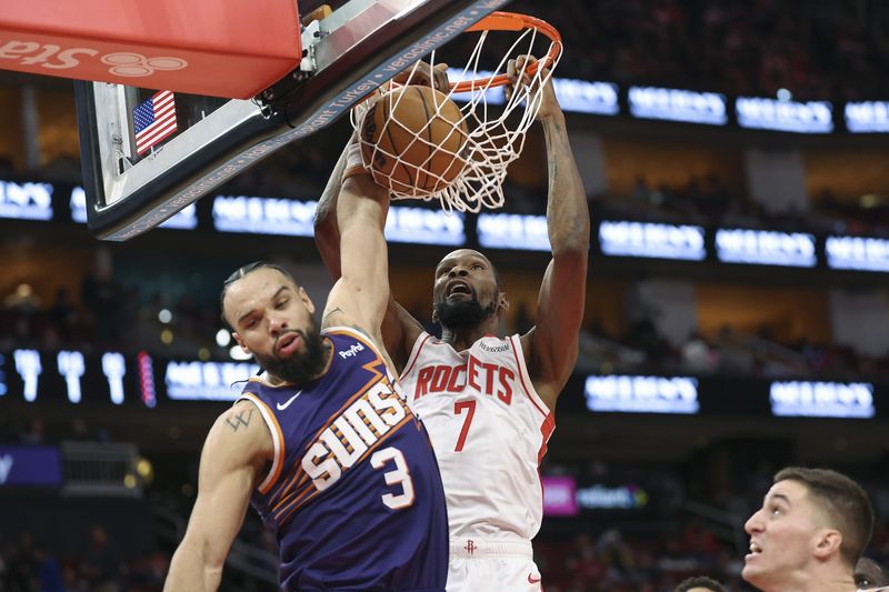 Dec 5, 2025; Houston, Texas, USA; Houston Rockets forward Kevin Durant (7) dunks the ball as Phoenix Suns forward Dillon Brooks (3) defends during the second quarter at Toyota Center. Mandatory Credit: Troy Taormina-Imagn Images