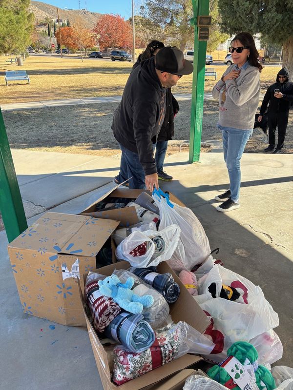 PJ Ferris, father of 6-year-old Ezme Ferris, who started the Cozy Item Drive in 2024, collects donations from the public at the collection day at Madeline Park, 900 East Baltimore Drive, on Saturday, Dec. 6, 2025, in West El Paso.