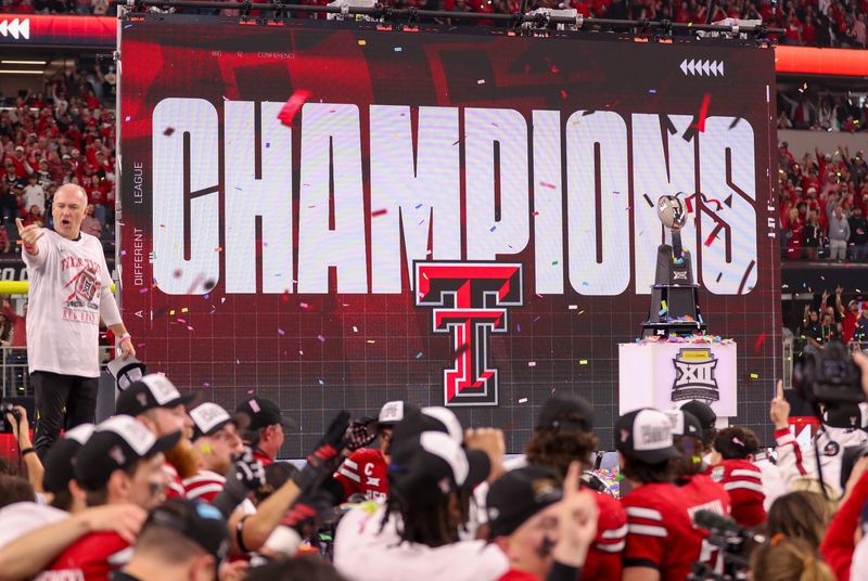 Texas Tech head coach Joey McGuire stands on stage after the Red Raiders defeated BYU 34-7 in the Big 12 Championship football game, Saturday, Nov. 6, 2025, at AT&T Stadium in Arlington.