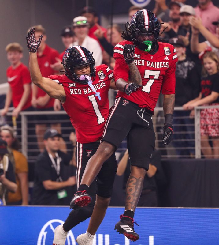 Texas Tech's Terrance Carter Jr. (7) celebrates his two-point conversion with Reggie Virgil against BYU during the Big 12 Conference championship game, Saturday, Nov. 6, 2025, at AT&T Stadium in Arlington.