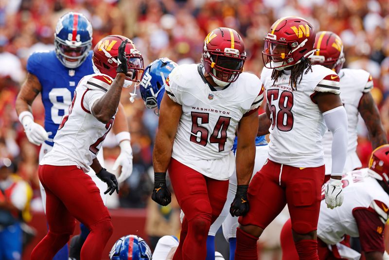 Sep 7, 2025; Landover, Maryland, USA; Washington Commanders linebacker Bobby Wagner (54) celebrates after a play during the second quarter against the New York Giants at Northwest Stadium. Mandatory Credit: Peter Casey-Imagn Images