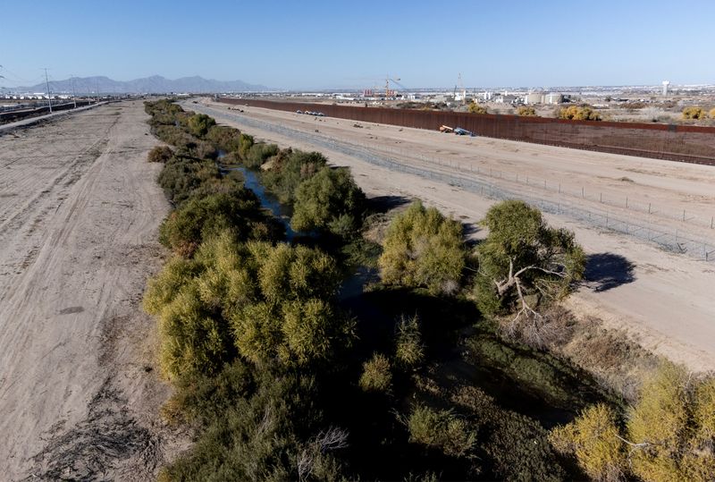 Razor wire lines the U.S. side of the Rio Grande as seen from Juárez, Mexico, across from Socorro, Texas, on Wednesday, Dec. 10, 2025. The Joint Task Force–Southern Border has begun placing razor wire across the nine Customs and Border Protection sectors along the southern border.