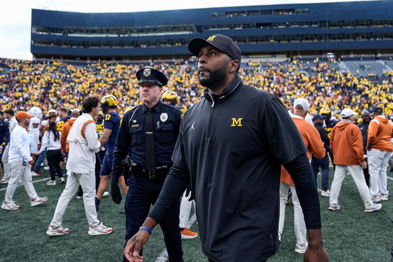 Michigan head coach Sherrone Moore walks off the field after the 31-12 loss to Texas at Michigan Stadium in Ann Arbor on Saturday, Sept. 7, 2024.