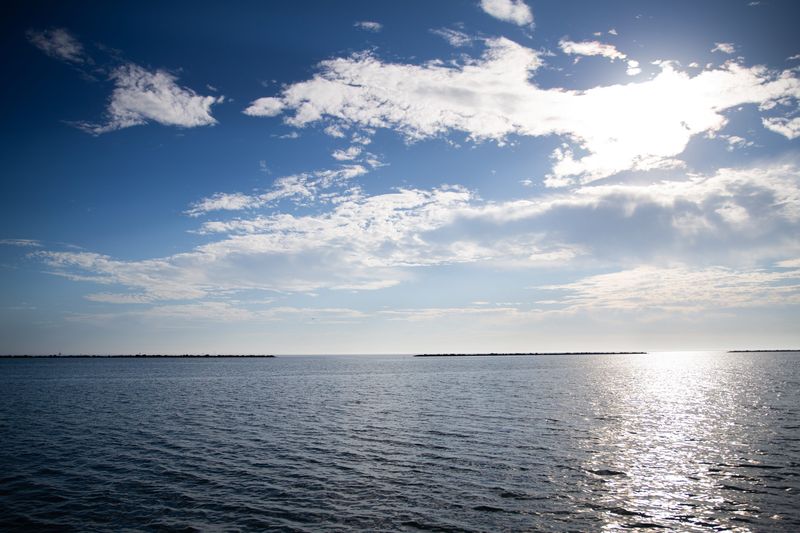 Seawater glistens under the sun on Dec. 12, 2025.