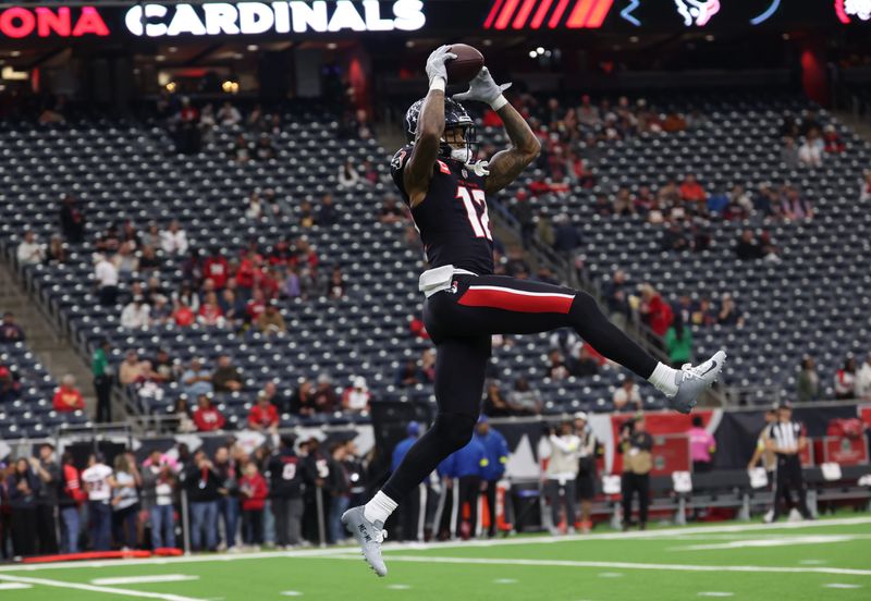 Dec 14, 2025; Houston, Texas, USA; Houston Texans wide receiver Nico Collins (12) catches a ball during warmups before playing against the Arizona Cardinals at NRG Stadium. Mandatory Credit: Thomas Shea-Imagn Images