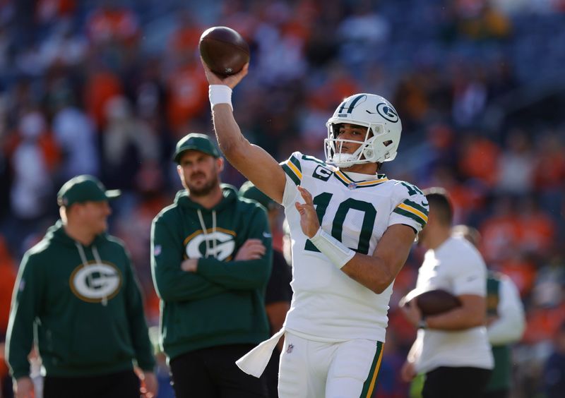 Dec 14, 2025; Denver, Colorado, USA; Green Bay Packers quarterback Jordan Love (10) warms up before a game against the Denver Broncos at Empower Field at Mile High.
