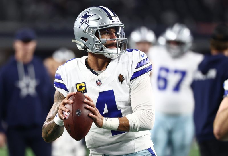 Dec 14, 2025; Arlington, Texas, USA; Dallas Cowboys quarterback Dak Prescott (4) warms up before a game against the Minnesota Vikings at AT&T Stadium.