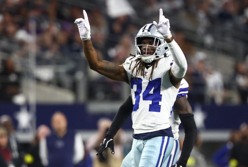 Dec 14, 2025; Arlington, Texas, USA; Dallas Cowboys cornerback Shavon Revel Jr. (34) celebrates after a play during the first half against the Minnesota Vikings at AT&T Stadium. Mandatory Credit: Kevin Jairaj-Imagn Images
