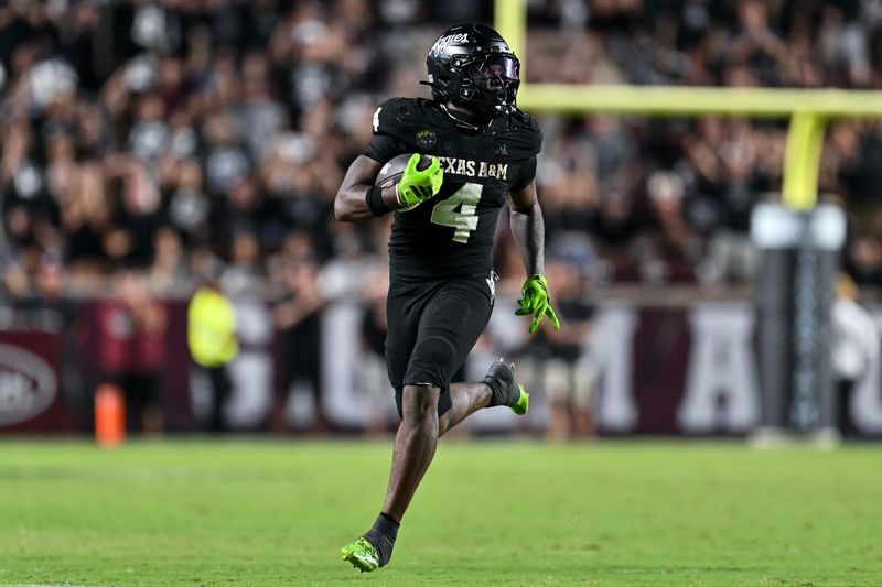 Oct 4, 2025; College Station, Texas, USA; Texas A&M Aggies running back Rueben Owens II (4) runs the ball during the fourth quarter against the Mississippi State Bulldogs at Kyle Field. Mandatory Credit: Maria Lysaker-Imagn Images