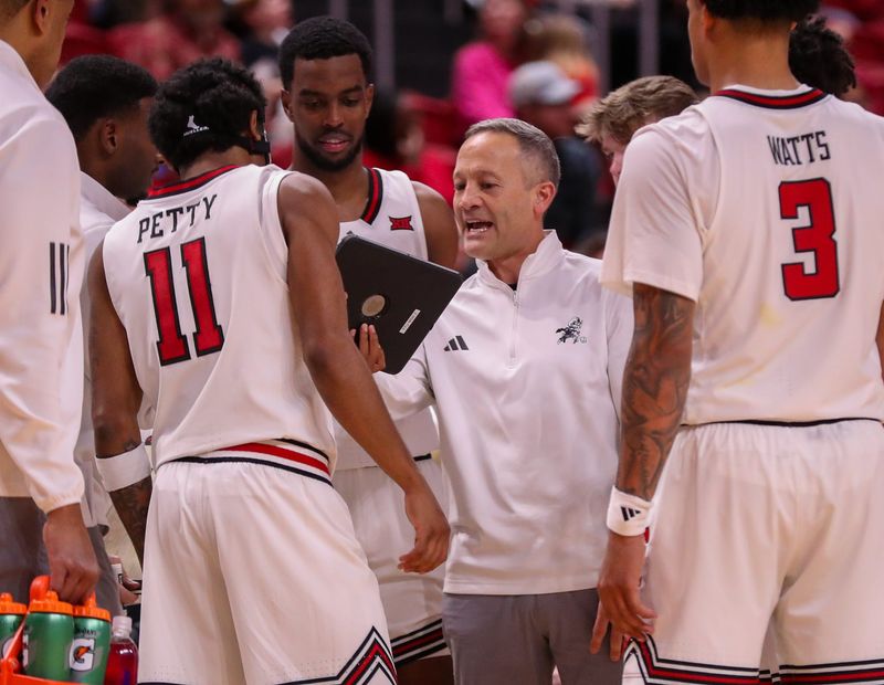 Texas Tech head coach Grant McCasland shows his team a video replay against Northern Colorado during a non-conference men's basketball game, Tuesday, Dec. 16, 2025, at United Supermarkets Arena.