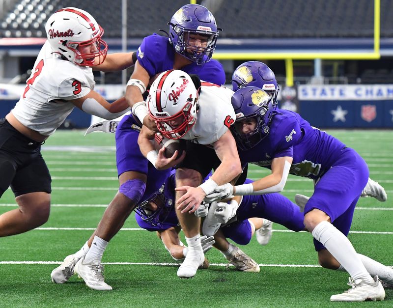 Muenster's Casen Carney runs the ball during the 2025 UIL 2A DII State Championship game against Shiner at AT&T Stadium in Arlington, on Thursday, Dec. 18, 2025.