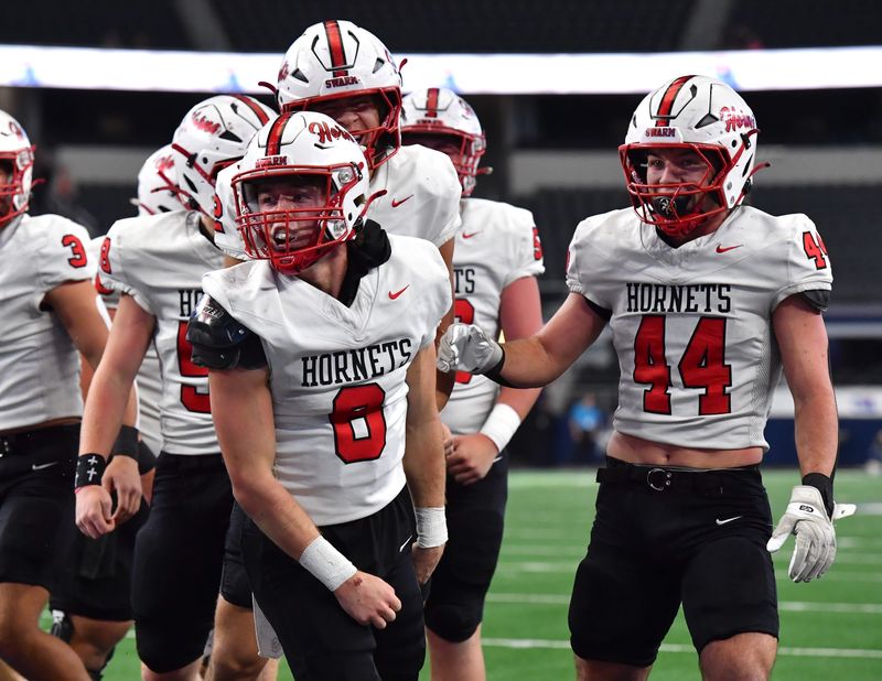 Muenster's Casen Carney (6) celebrates his touchdown during the 2025 UIL 2A DII State Championship game against Shiner at AT&T Stadium in Arlington, on Thursday, Dec. 18, 2025.