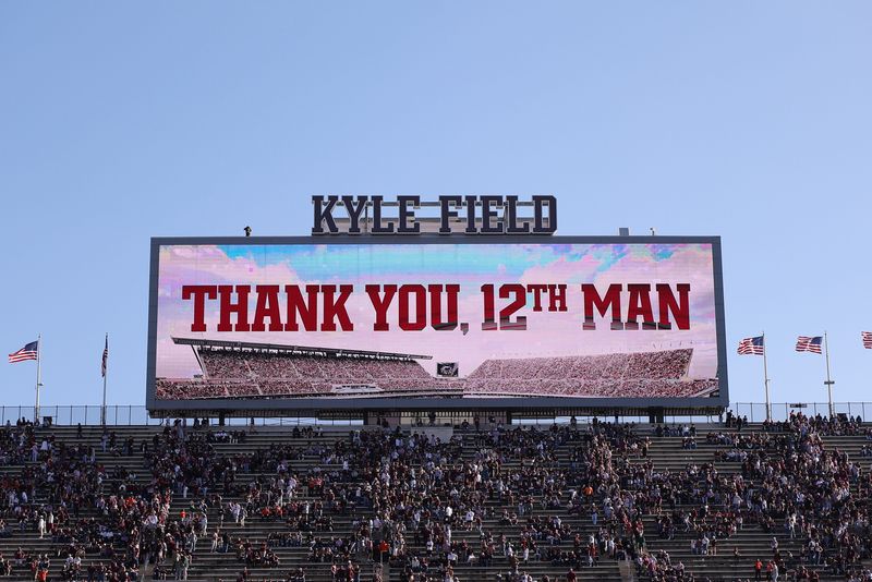 Dec 20, 2025; College Station, TX, USA; The video board says “Thank you, 12th man” during the first round game of the CFP National Playoff between the Miami Hurricanes and the Texas A&M Aggies at Kyle Field. Mandatory Credit: Maria Lysaker-Imagn Images